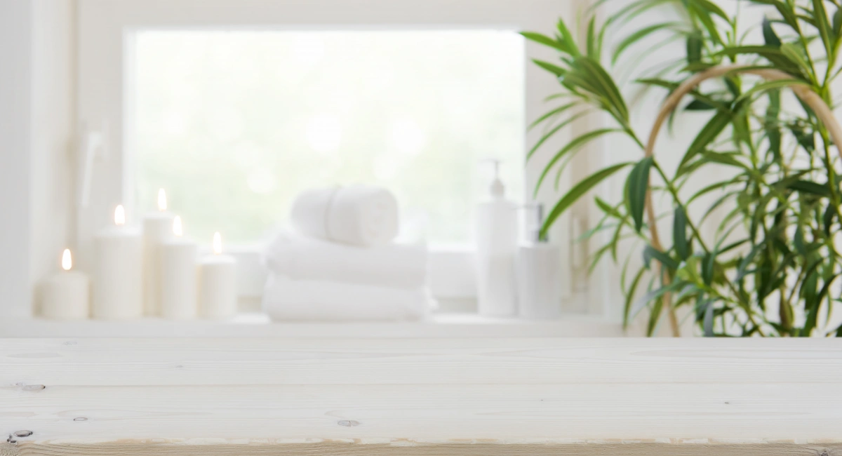 image-banner-stock-wooden-tabletop-with-copy-space-over-blurred-spa-884388614 (1).webp